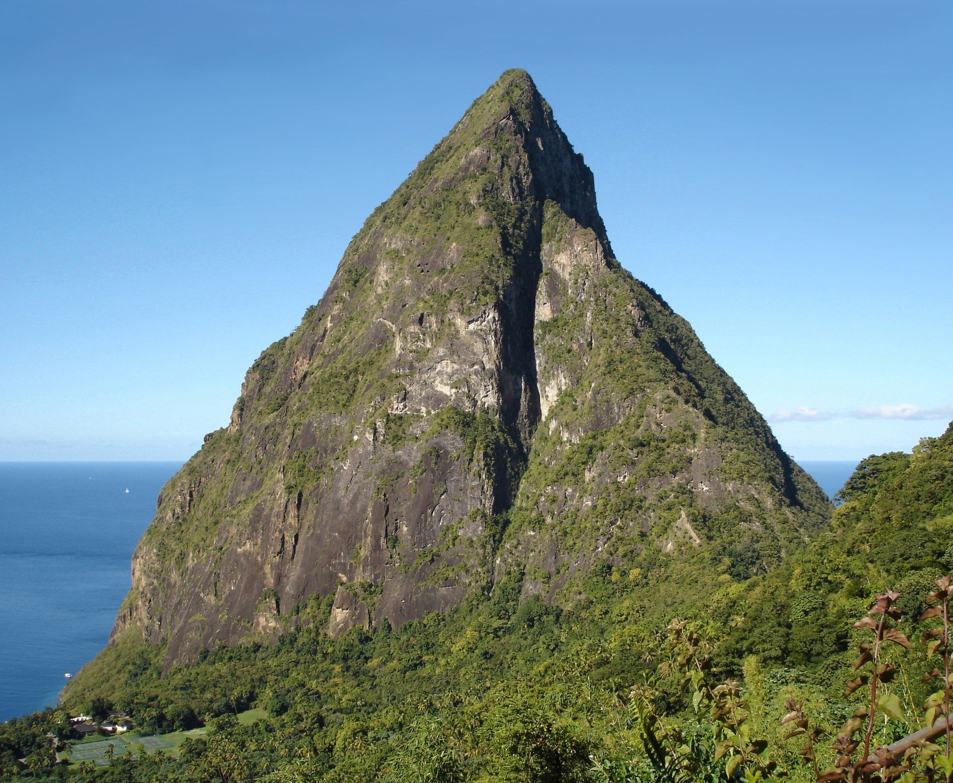 The forested volcanic peak of Petit Piton rising from the sea in Saint Lucia